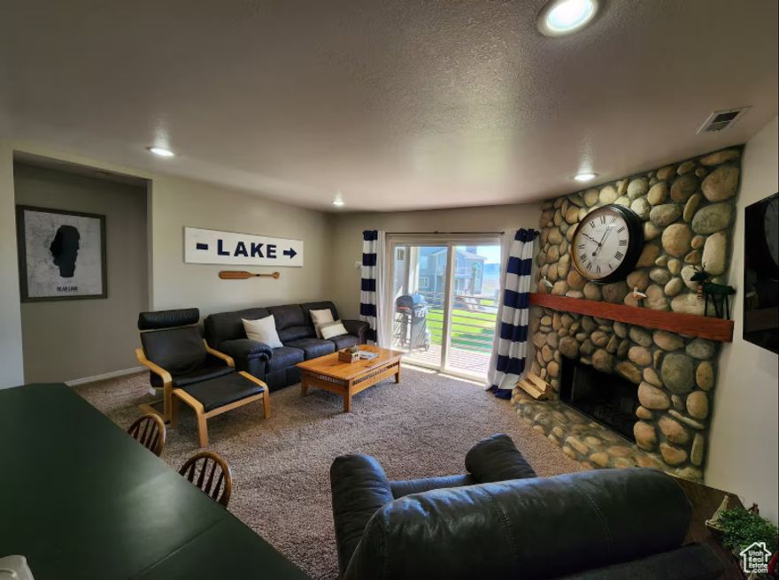 Lakeside Retreat in Harbor Village! Escape to your own slice of paradise with this charming condominium in the desirable Harbor Village at Bear Lake! Perfectly situated just moments from the stunning turquoise waters, this move-in-ready condo offers an ideal combination of comfort, convenience, and lakeside living. This property boasts a comfortable 1220 square feet of well-designed living space, featuring 2 bedrooms and 2 bathrooms, providing plenty of room for family and guests. The open-concept layout is perfect for entertaining, with a living area that flows seamlessly into the dining and kitchen spaces. Whether you're looking for a personal vacation home, a smart investment property (guests have been very happy with unit and current owner has been a SuperHost for the entirety of ownership) , or a year-round residence, this condo is a fantastic opportunity. Imagine mornings spent sipping coffee on a private patio or balcony, followed by a short walk or drive to the beach for a day of boating, fishing, or relaxing on the shore. Property is also within walking distance to Mike's Market and downtown Garden City. Go get yourself a famous raspberry shake!  Square footage figures are provided as a courtesy estimate only. Buyer is advised to obtain an independent measurement.