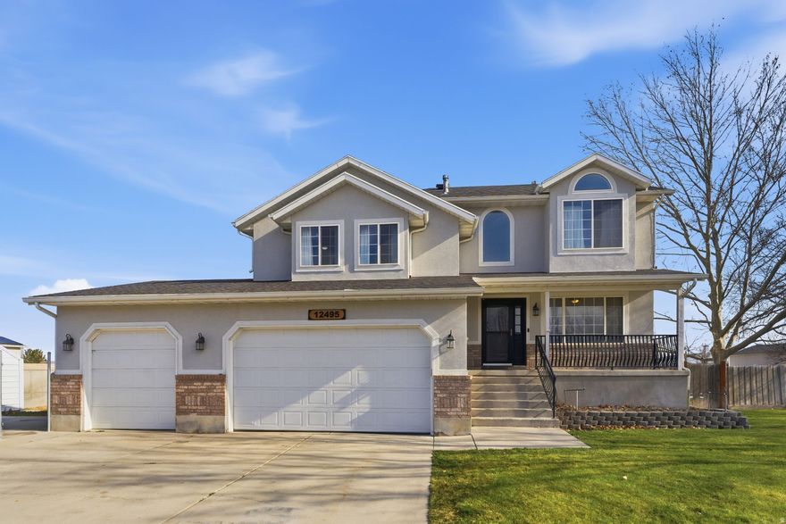 Welcome to your next home in the heart of Riverton! This 5-bedroom, 2.5-bathroom gem sits ona half an acre, offering a rare blend of space, comfort, and breathtaking mountain views. Inside, you'll find a well-designed layout that includes a generous great room-perfect for everyday living and entertaining-along with a large bonus room ideal for a home office, playroom, or guest space. The updated primary bathroom brings a modern touch to your personal retreat, while the additional bedrooms offer plenty of space for family or guests. Storage will never be a concern here. Between the oversized garage, the unfinished basement, and additional built-ins, there's room for everything from seasonal gear to hobby setups. Step outside and enjoy the expansive yard-ideal for gatherings, gardening, or simply taking in those incredible Wasatch mountain views. Whether you're upsizing, planting long-term roots, or seeking a home with space to grow, this property delivers on every front. Parcel # 27-29-478-012 is also included in the sale. Square footage figures are provided as a courtesy estimate only and were obtained from county. Buyer is advised to obtain an independent measurement.