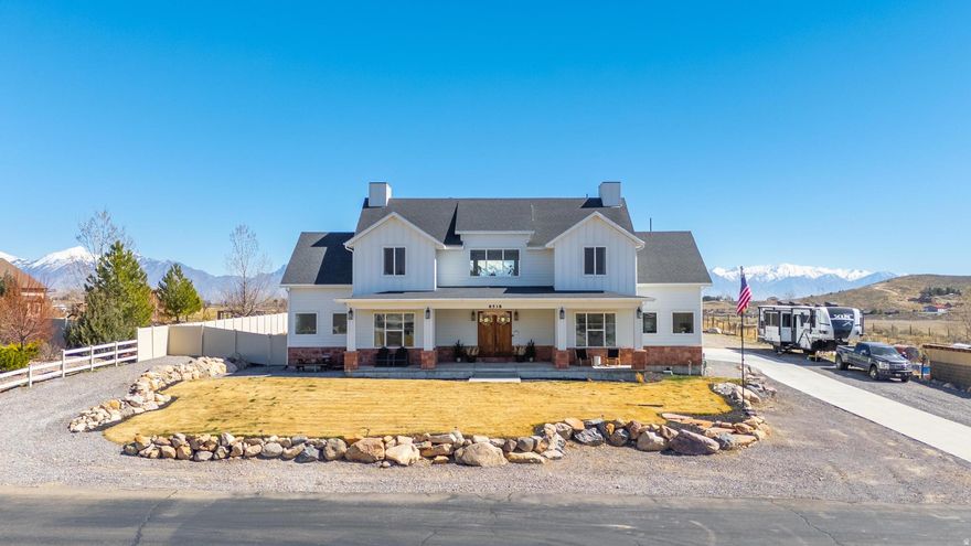 *** Open House Sat March 21st 3-5pm*** Panty dropper house... yeah, we said it. And no, your eyes aren't lying. Custom-built on 1 acre in North Utah County with a 1175 sqft  B.A.S. Garage!!! (Big As Shit... for your toys, your cars, your regrets, whatever.) No expense spared. Gourmet kitchen with a Wolf range for the chef who actually cooks, massive great room with 18 ft ceilings that make you feel like you're in a mansion, main-level primary suite plus another bedroom so your favorite kid doesn't have to suffer upstairs, 3 full baths, formal dining, office, mudroom... and a dog wash station, because your fur baby deserves better than a bathtub. Upstairs? 4 bedrooms for the rest of the crew and a bonus room so massive, you could host a small concert, build a racetrack, or finally admit that yes, Legos do belong in a separate zip code. Outside: more RV parking than the KOA. 5-car garage if you know how to park (4 car if you don't). Space for a pool, shop, trampoline, helicopter-whatever your flex needs. BUT WAIT, THERE'S MORE!  (Think Billy Mays) Gents, this is for you. Get us a full price offer and seller will leave a 30x45x15 shop kit for you. Yeah, you're welcome.... This isn't a cookie-cutter track home. This is the home your neighbors will gossip about while they drive by in their minivans. Open House Saturday, March 21 | 35 PM. Come see it... or cry later when someone else does. This is gonna go faster than a BYU couple who just held hands.