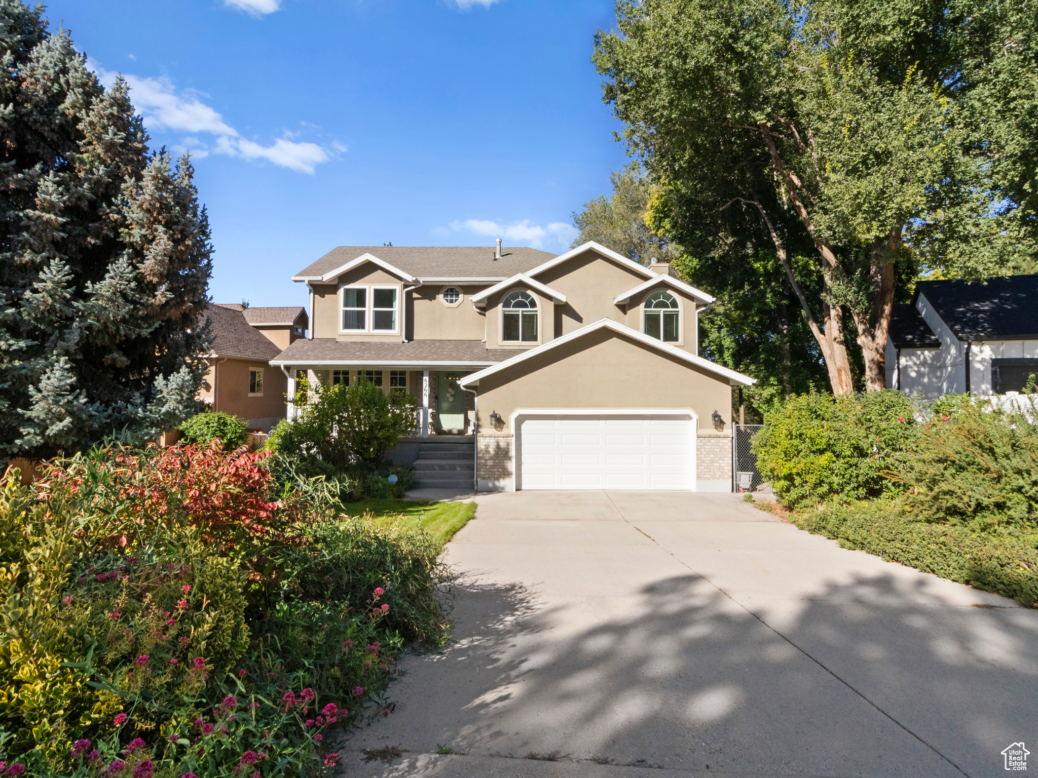 Immaculately maintained and spacious, this Holladay home sits on an oversized lot with amazing mountain views. Just minutes from canyons, shopping, restaurants, schools, and parks, it offers both convenience and tranquility. The private, lush backyard features a large vegetable garden, abundant fruit trees, and grapevines, creating a serene retreat. A west-facing deck is ideal for year-round entertaining. Recent upgrades include a new water heater, high-efficiency furnace, whole-house humidifier, and air scrubber. The walkout basement includes a full mother-in-law suite, adding versatility and value.