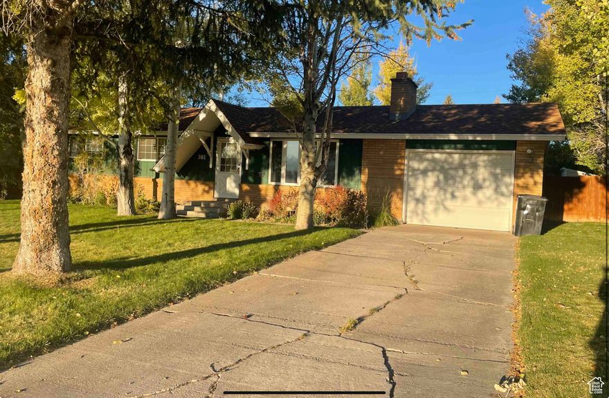 Charming 3-bedroom, 1.5 - bath home with a blend of brick and frame construction, featuring many updates throughout. Main level includes the main level primary suite and private bath and a spacious walk-in closet. A newly renovated main bath with shower/bathtub and an updated kitchen shines with newer cabinets, appliances and a convenient bar with extra storage and dishwasher. Downstairs, enjoy a cozy family room with fireplace, a third bedroom, and large storage area. A new bath and laundry room are already framed in - just waiting for your finishing touch. Additional highlights include a single car garage, some new windows, mature trees and a full sprinkler system for easy lawn care.