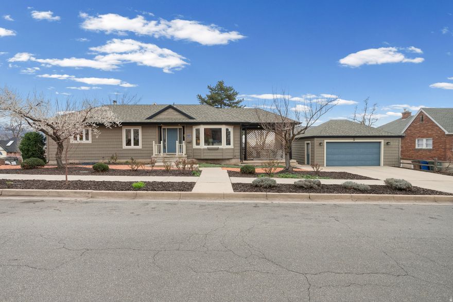 Contemporary 1995 turnkey home, with 2-car garage, in the Avenues. This maintained and updated home offers low-maintenance living with the Avenues vibe. Home cooks will enjoy the large kitchen with an island and breakfast nook. Proper brewery and Hatch chocolates are one block away, allowing you to grab a growler or ice cream to enjoy on your private patio. Several grocery stores, including Trader Joes, are nearby. Outdoor lovers will enjoy garage-to-trailhead access to many local trails and parks. Store your gear in one of the indoor storage areas or the garage. Conserve water with a waterwise, xeriscaped yard that includes two vegetable boxes and fruit trees. Parking is not an issue with a large 2-car garage and a 2 car cement parking pad. The corner lot is at the intersection of the community gathering spaces such as eateries, shops, public transportation, the library, the hospital, and parks, which brings a friendly neighborly vibe as the neighbors enjoy their evening strolls.