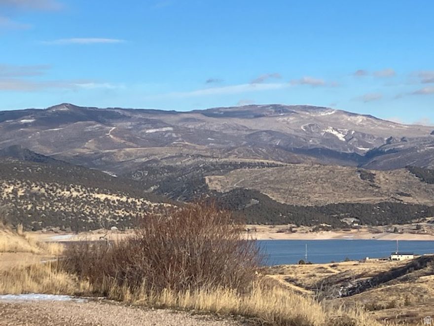 Price Reduced! Get out of the city congestion and smog and enjoy the great outdoors on this 20.05 acre view lot overlooking Rockport Reservoir and the neighboring Promontory Community. Views in the distance of Deer Valley! Located in a private gated community , this property offers 6.34 acres of buildable land and unmatched privacy with year round accessto Utahs stunning mountain scenery. Zoning allows one cabin with no size restrictions and 1 ADU up to 1000 sq ft of livable space. Improvements include , well outbuilding ,new 200 amp power to heat the well shed for year around water. Water rights secured with Weber Basin District, driveway with building pad ready to build.  Great option to build now then add second home above with amazing views. Within minutes of Rockport State Park for fishing, boating or paddle boarding. Bring your camper, water toys and ATV's and enjoy the wonders of nature. Only 45 minutes from Salt Lake and 20 minutes to Park City for shopping, dining, entertainment, skiing and golf. Seller has paid the fee to protect water rights. SHOW ANYTIME. Perc test just completed 9/2025, good to go. Buyer to verify all information. GPS COORDINATES: 4046'10"N 11125'27"W
