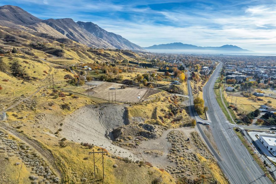 Introducing a premium development opportunity in Provo's highly sought-after Medium Density Residential zone. This project includes two parcels and allows for up to 16 townhome units with a flexible layout to suit a range of design approaches. The current concept features spacious 2,500 sq. ft. three-story townhomes with private, ground-level 2-car parking, open-concept living, and kitchen areas on the second floor, and well-appointed bedrooms on the third. Nine west-facing units also offer walkout basements, expanding their footprint to over 3,000 sq. ft. each. This is a rare chance to deliver thoughtfully designed townhomes in a prime Provo location.