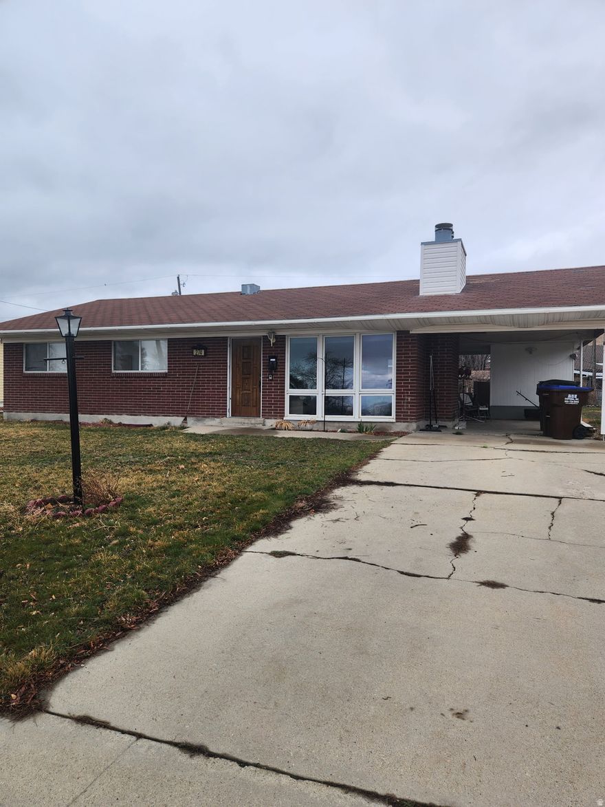 Gorgeous mountain views surround this charming Tooele home! The updated kitchen features sleek stainless steel appliances and modern finishes. The spacious owner's bedroom includes a private half bath with room to add a shower for a future upgrade. An unfinished basement with a fireplace offers incredible potential for additional living space or customization. Enjoy the large, fully fenced yard-perfect for entertaining, gardening, or relaxing outdoors. Buyer to verify all information.