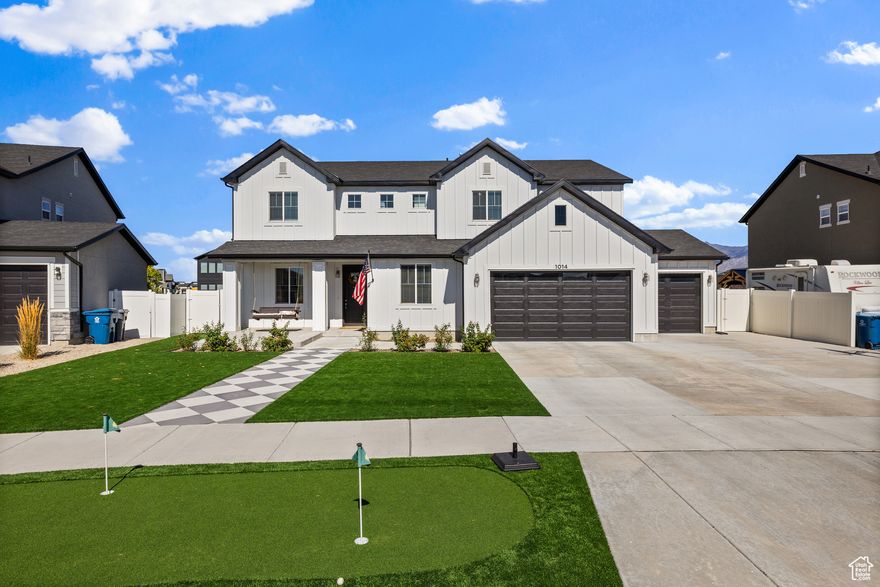 Newly Reduced Price!  Luxurious Sporty 5-Bedroom Home for Active Families & Sports Enthusiasts   Just minutes from I-15, shopping, and dining, this 5-bedroom, 3-bathroom home blends luxury finishes with active-living amenities. The two-story great room with vaulted ceilings and oversized windows fills the space with natural light, while a dedicated office and front living room with fireplace add style and flexibility.  The chef's kitchen features double ovens, gas cooktop, and quartz countertops, while crown molding, designer wall treatments, and custom closets elevate every room. The primary suite boasts vaulted ceilings, dual sinks, and a custom walk-in closet, with a second full bathroom also offering double sinks.  Step outside to your sporty backyard: turf front and back, putting green, in-ground basketball hoop, extended two-level patio, and space for a soccer field. The 3-car garage and massive driveway provide room for a gym setup and extra parking.  Move-in ready with luxury, comfort, and active-living appeal.