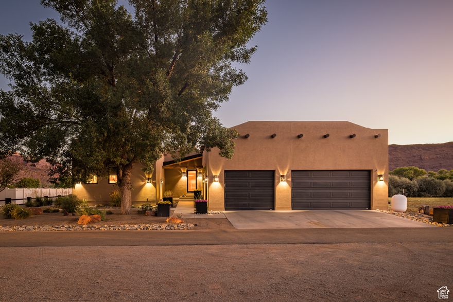 SOPHISTICATED GETAWAY - Refine your recreational getaway with this sophisticated and warm luxury home on Moab's north end.  Designed for upscale fun and entertainment, every inch of the property has something for everyone. The spacious kitchen will make the chef envious with Wolf and Subzero appliances, extra freezer drawers, double oven including steam, four-burner stove with grill, and quartz countertops. The inviting main bedroom suite enjoys two walk-in closets, lavish en-suite bath with dual head shower, and separate laundry.  Ten-foot ceilings elevate the senses throughout the entirety of the home featuring full home audio.  Ready to catch the game? You've got it - in your own theater room with 14.1 IMAX surround sound and seating for eight with individual comfort settings. Head out to the ultimate outdoor living on the back patio, finished with marble tile, and bask under the stars while you play table tennis or lounge around the fire pit with a featured film letting the ambiance ease the day away.  The Portal view will capture you daily as you enjoy the RV Resort amenities, including pickleball, 2 swimming pools, gym, and clubhouse. Walk right in and enjoy or rent monthly as most base furnishings are included, as well as the golf cart in the 3-car garage! Timeless elegance in a beautiful, gracious space.  Square footage figures are provided as a courtesy estimate only and were obtained from images. Buyer is advised to obtain an independent measurement.