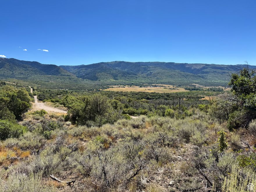 Charming 5-Acre Lot with Stunning Views  Imagine waking up to breathtaking valley views and the peace of nature right outside your door. This beautiful lot offers the perfect setting for your dream home, vacation retreat, or weekend escape. With road access from both the top and bottom, you'll enjoy convenience and flexibility. Just one hour from Lehi, this 5-acre property is full of charm and endless potential-ready for you to make memories.   Driving Directions - take a left when the pavement ends on Meadow view drive, take the next right on Southridge Rd, turn left onto Storm Mountain Dr, take next left onto Mountain Hollow Dr, start up hill and take a left onto Storm Mountain Drive. You will begin descending the hill and you will follow right to Valley View Drive or You can access the property from going straight on Mountain View Road until you you take a left of paradise road. You can can access property from both Valley View from the top or It maybe better to access from the bottom of the property of off Paradise Road. *** DO NOT GO UP Black Hawk Mount Estates Road ***