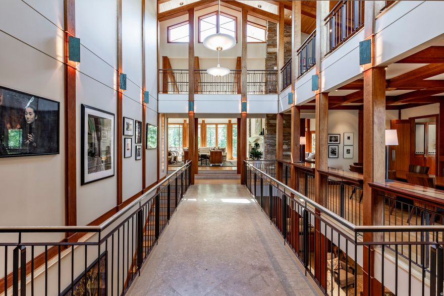 A one-of-a-kind architectural masterpiece inspired by the timeless vision of Frank Lloyd Wright, designed by noted Utah architect Max Smith and built by Craig Construction. Rooted in nature and elevated by design, this living gallery in the trees is a rare expression of art and architecture in harmony. Nestled on a premier corner lot among a canopy of aspens, this 11,138-square-foot estate offers exceptional privacy while making a striking artistic statement. Every line, material, and sightline reflects the philosophy that a home should exist in balance with its surroundings. With 5 bedrooms and 8 baths, the residence blends warmth and grandeur through horizontal lines, walls of glass, natural stone, and rich wood detailing. Sunlight fills thoughtfully curated interiors, where custom built-ins and museum-quality finishes transform each space into livable art. Designed for both intimate gatherings and grand entertaining, the home flows seamlessly from dramatic indoor spaces to expansive outdoor terraces. A stunning great room anchors the residence, complemented by formal and informal dining areas, a chef's kitchen with professional-grade appliances, and inviting lounge spaces. The primary suite offers a private retreat with serene aspen views, a spa-inspired bath, and boutique-style dressing rooms. Guest suites provide comfort and seclusion, each carefully positioned to preserve the home's sense of tranquility. More than a residence, this estate is a statement-where architecture becomes art and living becomes an experience.