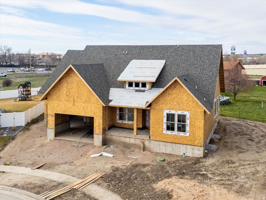 Welcome to the Thursten Custom Home at Mountain View Estates, a one-of-a-kind custom residence located at the end of a quiet cul-de-sac with easy access to the Legacy Parkway trail system. This home is built around vaulted, open-concept living that connects the great room, gourmet kitchen, and dining area for effortless everyday flow. The main-floor primary suite features vaulted ceilings and an oversized walk-in closet, while an exceptional XL laundry room with a utility sink adds rare, real-world functionality. Outdoor living is enhanced by a covered front porch and a covered Trex deck, and the finished basement expands the home with flexible space for guests, recreation, and storage. Home is under construction, completion is expected towards the end of May.  Call today to set up a showing.