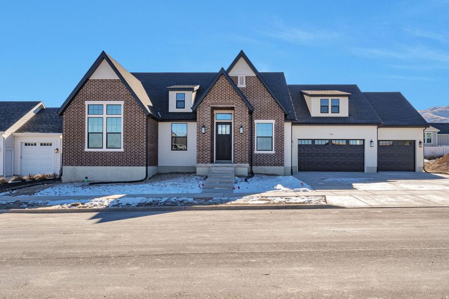 LOT#130 in Beacon Pointe, by Symphony Homes- The Roosevelt XL. This stunning, newly built rambler plan offers 2 bedrooms and 2.5 baths on the main floor, thoughtfully designed with luxury and comfort in mind. The primary suite features an elegant spa-like bath with a full tile wall, free standing tub, oversized shower with built-in bench and a spacious walk-in closet with custom built-ins. The 2nd bedroom features a vaulted ceiling and its own ensuite bath. This functional floor plan features a versatile flex room with French doors plus a formal living room off the entry. Large laundry room with countertops, sink, and lots of cabinetry. The gourmet kitchen is a showstopper with high-end appliances, a butler's pantry, and designer finishes throughout. The finished basement expands the living space with two additional bedrooms both with large walk-in closets and one with an ensuite bathroom, a home gym with rubber floor and mirrored wall, a sprawling family/game room and open theater complete with an attractive wet bar, cold cellar, large finished storage room, and more. A radon mitigation system adds peace of mind. With exquisite interior details and thoughtful upgrades at every turn, this home is truly one of a kind.