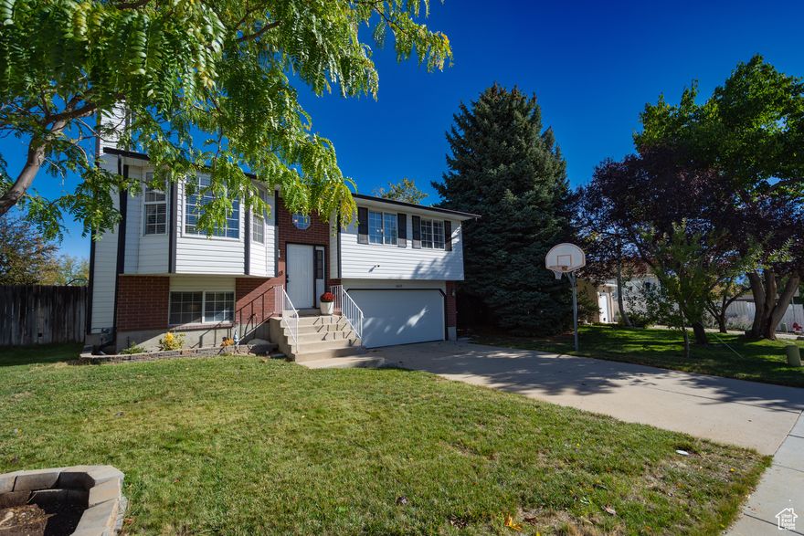 GREAT HOME IN PRIME LOCATION w/EXTENSIVE UPGRADES ! Beautifully Maintained & Thoughtfully Updated Home Nestled In A Desirable Neighborhood Just Minutes From Premier Shopping, Dining & Everyday Conveniences. This Residence Offers Both Comfort & Peace Of Mind. Step Inside To Discover An Inviting Interior Updated By The Previous Owner. Featuring Newer Flooring, Base & Case, Lighting, Paint & A Stylish Fireplace Mantle That Serves As A Charming Focal Point. The Modern Kitchen Showcases Sleek Stainless Steel Appliances(2022), Perfect For Home Chefs & Entertaining Guests. Enjoy Added Value With The Reverse Osmosis System & Water Softener Installed In 2023, As Well As New Blinds, Water Heater & Garage Door Replaced In 2024. The Bathrooms Have Been Tastefully Upgraded With New Showers On Both Levels(2023), Offering A Fresh & Contemporary Feel. The Downstairs Living/Flex Room Can Easily Be Dedicated As A Bedroom. Exterior Improvements Include New Gutters(2022), Lawn Aeration & Reseeding September 2025. Enjoy Controlling The Sprinklers Right From Your Phone To Help Make Watering Very Convenient & Ensuring A Lush & Inviting Yard For Outdoor Enjoyment. This Information Herein Is Deemed Reliable But Is Not Guaranteed. Buyer Is Responsible To Verify All Listing Information, Including Square Feet/Acreage, To Buyers Own Satisfaction.