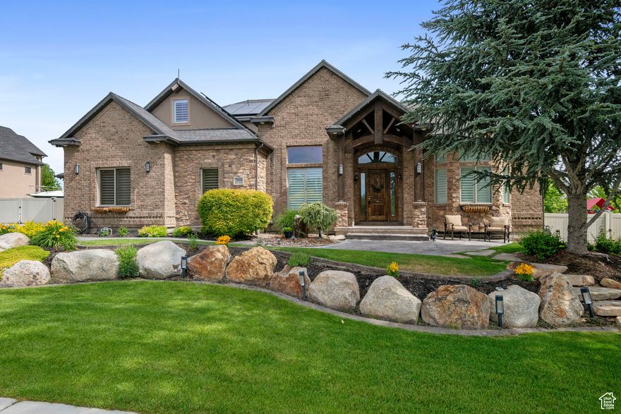 Welcome to this extraordinary home, where luxury meets functionality in every corner. The spacious master suite offers ultimate comfort with his-and-hers closets and a dedicated mini-split system for personalized climate control. A main HVAC system-just 2 years old-ensures year-round efficiency throughout the home. Perfect for entertaining, the fully finished walk-out basement features a second kitchen, a theater room, and elegant French doors that open to a seamless indoor-outdoor living experience. Step outside to the stunning new paver patio, ideal for gatherings, complete with a gas hook-up and beautifully framed by cascading waterfalls in both the front and backyard. The chef's kitchen is a culinary dream, outfitted with a built-in warming oven and a reverse osmosis system. Everyday convenience is elevated with a central vacuum system and abundant storage throughout. For added peace of mind, a hidden fireproof room offers its own independent ventilation system-perfect for secure storage or a private retreat. The garage is a standout feature, fully equipped with a generator that automatically powers the home during outages, an air compressor, and a high-pressure wash system-making it a dream setup for hobbyists and professionals alike. Tech lovers will appreciate the full surround sound system and GoBee smart lighting that brings vibrant ambiance to the exterior. And with five 300-gallon water tanks, the home is well-prepared for any emergency. Every detail of this property has been thoughtfully crafted for comfort, security, and luxury. This is more than a home-it's a fully equipped, self-sustaining retreat.
