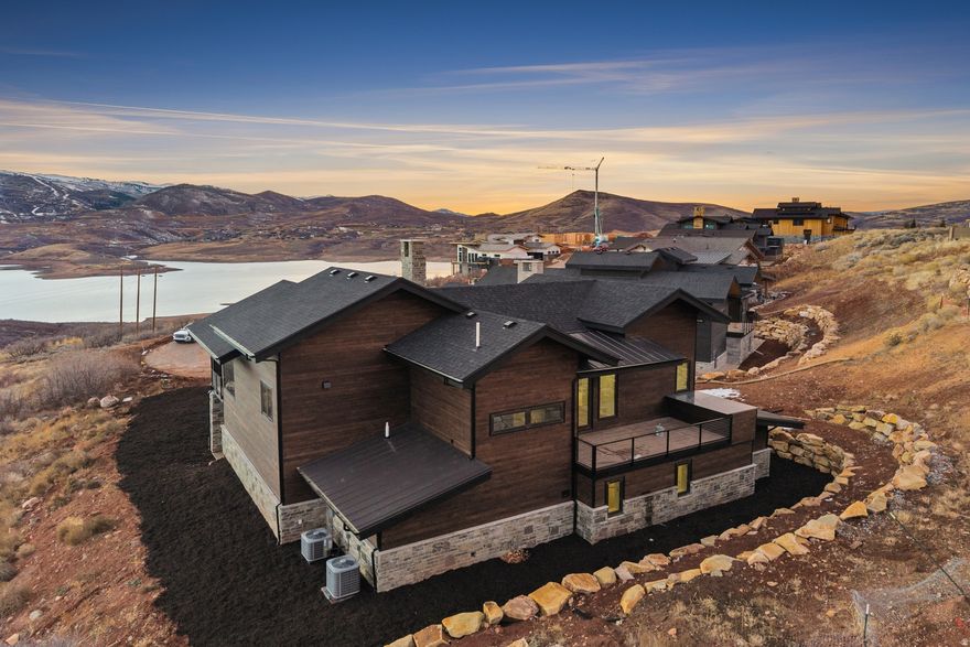 Spectacular ski area and Jordanelle views from new mountain modern home!! Outstanding views in this high-quality new build perched above the Jordanelle, located at the end of a cul de sac.  Enjoys panoramic views of Deer Valley, Mt. Timp with amazing southwestern exposure. Easy access to DV East Village, Kimball Jct. and Park City. Award winning Boston based architect has created a wonderful 5 bedroom, 5 bath home, great for entertaining and family gatherings.  Large front deck with hot tub offers incredible ski area and Jordanelle views. A large back deck for reading a book, enjoying a cup of coffee, and grilling provides wonderful afternoon shade. A second family room provides additional space for playing board games and watching movies. Expected completion date, November, 2025.