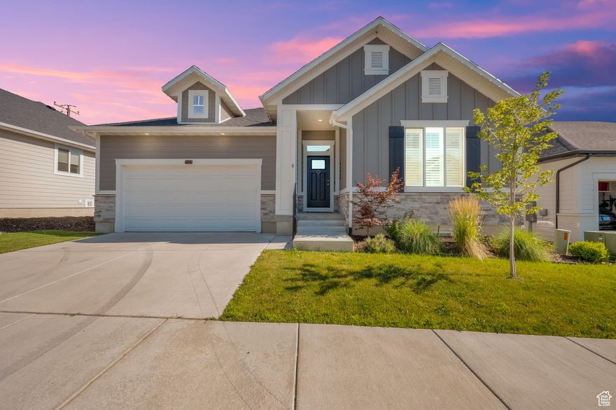 Gorgeous main floor living in the heart of Davis County. Your new home feature a beautiful kitchen with 2-tone cabinets, large island, plenty of cupboard space, and a huge walk-in pantry. The backyard features artificial turf for easy maintenance, multiple garden boxes, a family-sized patio for all your gatherings, and an extra cement pad for a future shop/storage shed (approved by HOA). Owner's suite with double vanity and walk-in shower. Additional features include: Elevator for easy basement access, seasonal roof lights, painted garage w/ 220 power, garage salt bin, and UTOPIA Fiber included and FULLY paid, for blazing fast internet at a fraction of the cost.