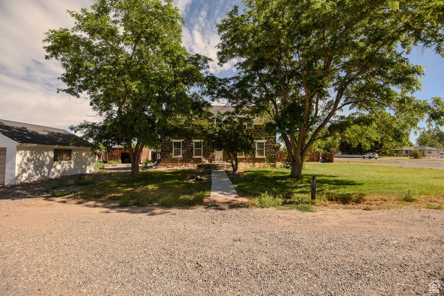 Step into a piece of history with this stunning two-story home, nestled on a spacious .45-acre corner lot in the desirable Black Rock neighborhood. This captivating property features a blend of timeless character and modern potential, making it the perfect canvas for your dream home. Key Highlights: - **Historic Charm**: Experience the unique architectural details that tell a story, offering warmth and character throughout. - **Ample Outdoor Space**: Enjoy the freedom and privacy of a generous .45-acre lot, perfect for outdoor gatherings or gardening. - **Convenient Storage**: Benefit from two storage sheds, providing plenty of space for tools, toys, or seasonal items. - **Detached Garage**: A one-car garage ensures easy parking and additional storage options, making daily life a breeze. - **Partial Landscaping**: With a lovely existing landscape to build upon, you can easily transform the outdoor space into your personal oasis.
