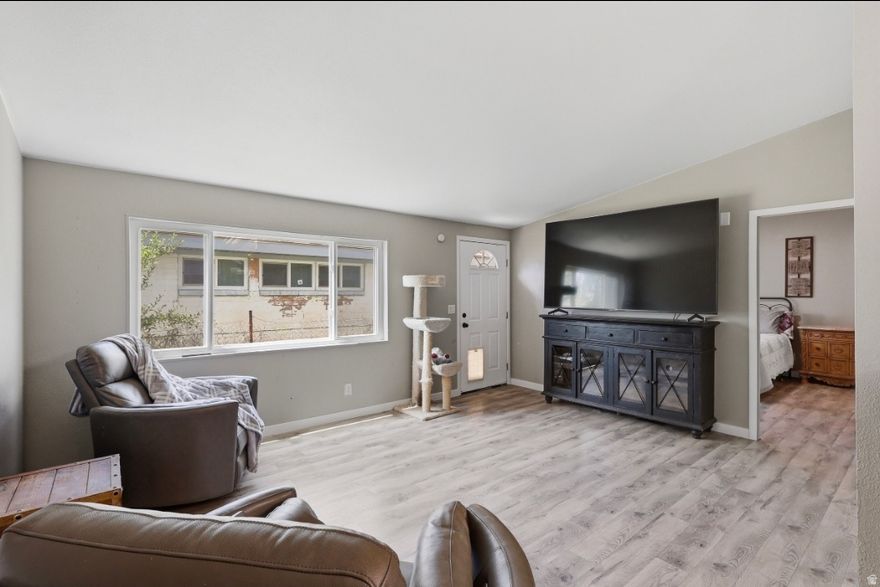 Hard to find at this price point! So many of the expensive projects are already DONE - including new windows ($14k value alone), plumbing, bathrooms, flooring, plus fresh interior and exterior paint.  3 bed | 2 bath | approx. 1,500 sq ft  All one-level living - save your knees and skip the stairs  Large 2-car garage  Plenty of parking space  Situated on .19 acre with room for kids, dogs, toys, or backyard BBQs  NO HOA - because your payment is high enough already And the best part? It's a detached home... meaning you don't have to listen to your neighbor snoring through the wall like in a condo or apartment.  The open great room and layout truly need to be seen in person to appreciate. Qualifies for traditional financing, including 100% financing through Utah Housing for qualified buyers!