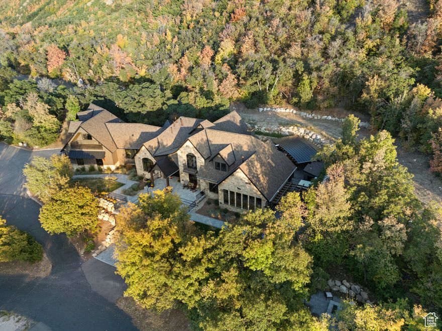 Spectacular Mountain Retreat at the mouth of #HobbleCreekCanyon in #SpringvilleUtah . "The Phoenix" has been completely renovated. Down to the studs. It was in the #ParadeofHomes 2023. Crisp #mountain air. You will feel the ZEN as you step foot on the property, but then when you enter, you will experience it...Peace. Healing. Beauty. Calm. This is a very special place. There are really too many beautiful finishes to name them all, but here are a few: You approach the home on radiant heated  paver walkways and driveway. The grand entrance is graced with a stunning Bronze sculpture of a phoenix, after which the home is named for: "The Phoenix at Hobble Creek". Rough timbers welcome you in. Gorgeous views of the scenery from every window. The den and the dining look out onto the Pheonix and the valley. Beautiful gathering area leads out to a private patio with an outdoor kitchen, fireplace, sauna, hot tub, and fire pit. The property reaches up very high as you look up to a gorgeous rock formation, and then it extends down to the creek and even across at some points. Plenty of parking. for parties! Parking for 22+/- cars.  ADU/apartment with an outside entrance and conservatory. Even you own ELEVATOR! Theater room, bunk room and basement kitchen with basement entrance and access to additional garage. Cutting edge water filtration system for the whole house.  The Primary suite is on the main level with a door out to the jacuzzi and the sauna. Lower garage was excavated and added at the time of renovation.  Timeless yet rustic yet elegant yet cozy. Hard to envelope all of these vibes into one home. Most all furniture is negotiable. *Video for the home: https://sites.listvt.com/vd/213589646 *website for the home: https://sites.listvt.com/public/photos/213329326