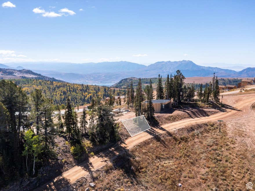 A rare opportunity at Powder Mountain, this premier ski-in/ski-out lot offers the chance to live literally on top of the mountain, surrounded by endless views stretching across the Wasatch Range and beyond. Wake up to alpine sunrises and finish your day skiing right to your door in one of the most exclusive mountain communities in the country. With eligibility to join the Private Powder Mountain Membership (with additional fees), owners can enjoy private terrain, crowd-free skiing, and access to world-class amenities. Positioned among architecturally stunning homes, this lot is one of the most affordable ways to secure the Powder lifestyle, combining unparalleled elevation, breathtaking scenery, and adventure in every season. Boundary lines are provided as a courtesy estimate only. Buyer is advised to obtain an independent measurement.