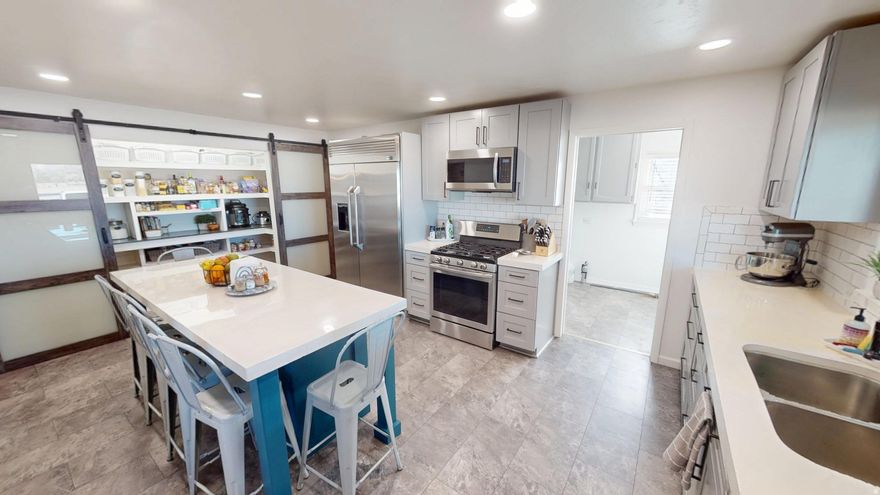 Rare .85-Acre Single-Level Estate | 1212 W 500 N, Vernal, UT 84078  This expansive 4-bedroom, 2.5-bathroom single-level residence offers 2,365 sq. ft. of meticulously updated living space. Situated on a massive .85-acre lot with active water right and a private well, this property is a premier find for those seeking self-sufficiency, workshop space, and high-end finishes.   Masterful Renovations & Technical Specs Interiors: Featuring original, professionally restored hardwood floors and a complete kitchen remodel with modern cabinetry, and Stainless-Steel appliances with Gas Range.  Mechanical Reliability: Both the Furnace and Central AC were replaced in 2019, providing modern efficiency in a classic 1953 frame.  Self-Sufficiency: Includes a well with a deeded water right, offering incredible value for gardening, or maintaining the expansive lot.   The Ultimate Toy & Hobbyist Setup This property offers an unparalleled storage and workshop configuration:  Garage Capacity: A deep, attached 2-car garage plus a 2-car carport.  Detached Shop: A separate 2-car garage/workshop fully equipped with power and a wood-burning stove, ideal for year-round projects or vehicle restoration.  Unlimited Parking: Extensive space for RV parking, boats, and outdoor gear, all on your private acreage.   Vernal Location & Lifestyle Data This home is strategically positioned for both daily convenience and world-class recreation:  Education Proximity: Located in a premier school corridor-just minutes from Ashley Elementary and less than 0.7 miles from Uintah High School.  Recreation Hub: Only 15 minutes from Steinaker State Park and Red Fleet State Park (famed for its dinosaur tracks and "Little Lake Powell" vibes). You are the gateway to Dinosaur National Monument and the Uinta Mountains.  Downtown Access: Quick access to Vernal's newly improved Main Street, featuring the Utah Field House of Natural History and the popular Vernal Brewing Company.  Contact us today to schedule your private tour of this one-of-a-kind Vernal property!