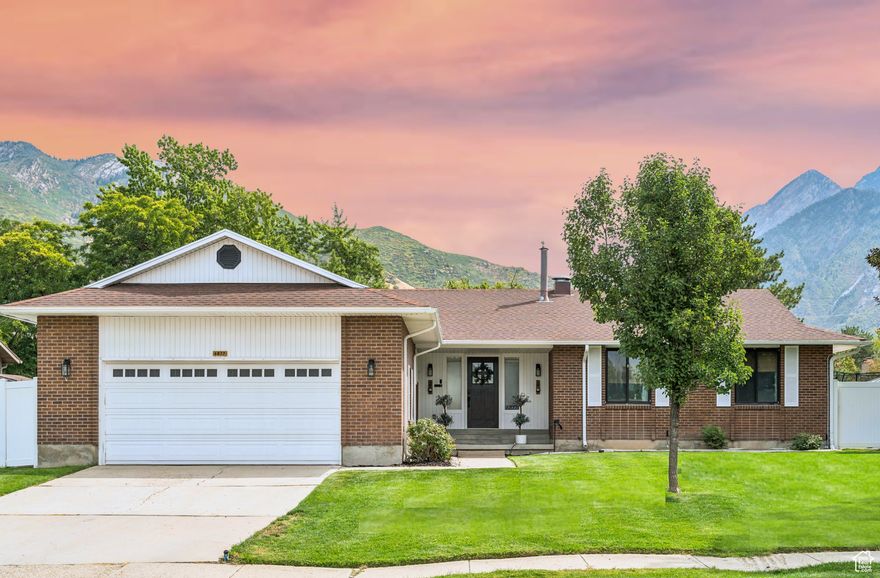 Don't miss your chance to own a home in one of Cottonwood Heights' most sought-after neighborhoods! Perfectly positioned just 2 minutes from the base of Big Cottonwood Canyon, this beautifully remodeled brick rambler sits on the corner of a quiet cul-de-sac with sidewalks, mountain views, and a strong sense of community.  Over the past three years, this home has undergone a complete transformation. Top-to-bottom upgrades include a new furnace and AC, all new windows in the basement, a 200-AMP exterior electrical panel, Senawave Fiber Internet, fresh paint throughout, a radon mitigation system, new carpet, tile, LVP flooring, trimwork, custom railings, quartz countertops, updated bathrooms, and lighting fixtures.  Step into the open-concept main living area where the chef's kitchen features high-end custom solid wood cabinetry, dovetail joints, soft-close drawers, a stone backsplash, convection gas double wall ovens, gas range, deep stainless steel sink, stainless steel fridge, and a brand-new KitchenAid dishwasher-all surrounded by sleek quartz countertops.  The bright living room flows seamlessly into a stunning dining space featuring a wood-burning fireplace with a custom wood mantle and built-in shelving for both style and storage. Upstairs, you'll find three bedrooms offering flexibility for a home office or guest space. The primary includes a luxurious ensuite bathroom with a euro-glass shower and a rainfall showerhead. Main floor laundry adds everyday convenience.  Downstairs, enjoy a large living room, dining area, mini bar with sink, and a flex space with a custom rock feature wall-ideal for hobbies or a second office. A second wood-burning fireplace with an oversized hearth creates a cozy retreat after a day on the slopes. Two additional bedrooms and a full bathroom with an oversized vanity offer room to grow. One of the downstairs bedrooms is spacious enough to accommodate a full home gym, complete with electrical hookups for an ice plunge.  Outdoor living is a dream with a new covered pergola, wiring for a hot tub, an area for couches and a firepit, and a dedicated entertainment area that has been used with a projector screen for movie nights under the stars. Privacy panels and planter boxes enhance the intimacy of the space while preserving breathtaking mountain views.  Storage is abundant with two basement storage rooms, a two-car garage, and an exterior concrete slab. Commuting is a breeze with quick access to I-215 via the 6200 S exit, and you're less than 30 minutes from Solitude and Brighton ski resorts. Located in the highly rated Canyons School District, this home offers both luxury and practicality.  Hundreds of thousands in upgrades have turned this 1980s rambler into a modern, move-in-ready haven-perfect for entertaining, relaxing, and enjoying everything Cottonwood Heights has to offer.