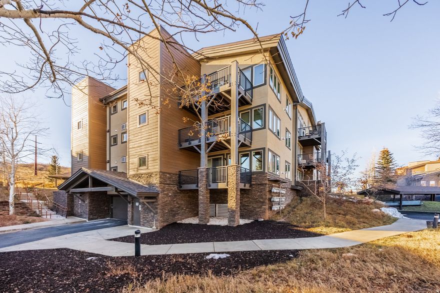 Set within the desirable Crestview community, this light-filled residence offers an effortless blend of comfort, convenience, and mountain charm. Thoughtfully designed with an open-concept layout, the home is bathed in natural light and framed by picturesque mountain views. The kitchen serves as a welcoming hub, seamlessly connecting to the living area to create an inviting atmosphere for both gathering and relaxation.  Step outside through sliding glass doors to a covered deck-an ideal extension of the living space and a perfect place to enjoy fresh mountain air in every season. The primary suite features an ensuite bath and a spacious walk-in closet, while in-unit stackable laundry adds everyday ease.  Additional highlights include heated, secure underground parking with elevator access, along with ample surface parking for guests. The building has recently completed comprehensive exterior improvements, including new windows and decks, enhancing both aesthetics and long-term value. Located in Building C, residents enjoy immediate proximity to the clubhouse and its amenities, which include an outdoor pool, hot tub, and fitness center.  Pet-friendly for animals under 35 pounds, this residence is ideally situated on the free Park City bus route in Kimball Junction, providing seamless access to Salt Lake City, world-class recreation, and Park City's iconic Main Street.