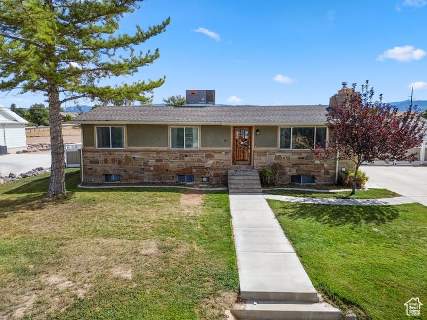 PRICE REDUCED TO $399,,900  FHA assumable loan at 3.125 % Call for details !!  This home has the perfect set up to not only accommodate the toddler, it is also set up to accommodate the fussiest of teens wanting their own private space--here we've got you covered! Professionally designed & installed high vinyl fence with new sprinkler system, sod, barbecue pit and 2 storage sheds to store all of your summer furniture makes this back yard with newly installed sprinkler system a hidden sanctuary!! Home has a newer gas fireplace, newer gutters, custom kitchen cabinets, custom cement countertops and adorable updated main floor  bathrooms and lots of basement storage. Square footage figures are provided as a courtesy estimate only and were obtained from Sanpete County.  Buyer is advised to obtain an independent measurement. SELLER REQUESTS 24 HOUR NOTICE FOR SHOWING APPOINTMENTS.