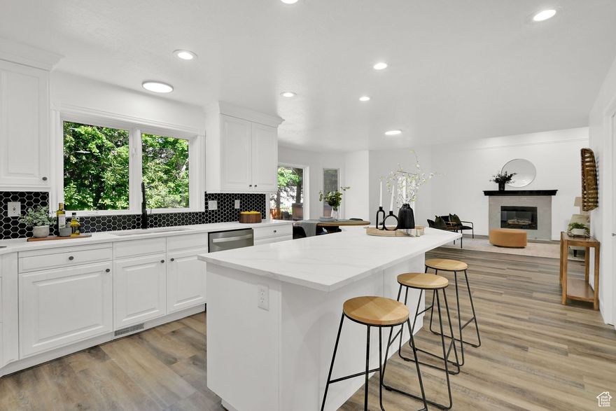 **Come see it before the beautiful staging is gone on Friday November 21st ** Welcome to this beautifully updated residence in the highly desirable Mountain Meadows community. Thoughtfully upgraded throughout, this spacious home offers comfort, functionality, and peace of mind. Step outside to take in breathtaking mountain views, complemented by a three-tiered waterfall and an additional tranquil water feature just outside the back door. A secluded patio provides an ideal setting for outdoor dining, or simply unwinding in privacy. The expansive three-car garage offers ample space for vehicles, toys, and additional storage. Inside, you'll find two AC units and two furnaces to ensure year-round comfort and efficiency. A gas generator to put your mind at ease when the power goes out. The open-concept kitchen and living area seamlessly flow to the outdoor patio, creating an inviting atmosphere for gatherings. The primary suite is a true retreat, filled with natural light and featuring a spa-inspired bathroom you must see in person. Upstairs, two additional bedrooms each enjoy their own private vanities-perfect for guests or family members. The fully finished basement has four more bedrooms, a large workout room, and a generous family room, offering flexibility and space. This exceptional home truly has an all-luxury, space, and an unbeatable east bench location, all for under a million. Come experience it for yourself!