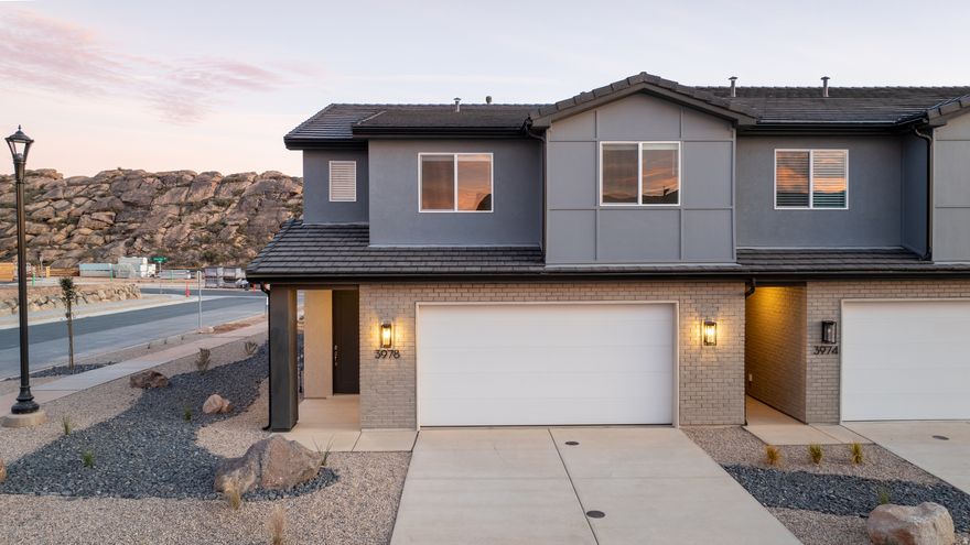 Step into The Sunrise, where versatile living meets spacious comfort. Nestled in Coral Canyon, this end-unit 2 story townhome, with 4 bedrooms and an open-concept design, is bathed in natural light from its abundant windows. Thoughtfully crafted for both relaxation and activities, the home features dual vanities, walk-in closets, and ample storage to keep life stylishly organized. The large great room and central kitchen island create the perfect setting for everyday adventures and memorable gatherings in the welcoming Coral Canyon community.