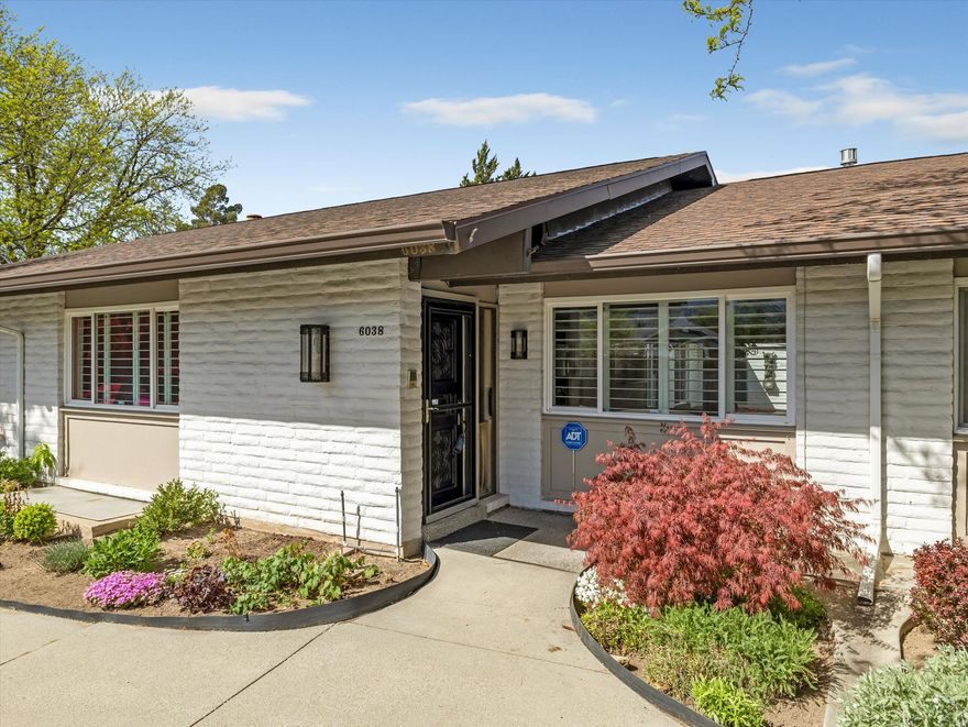 Rarely available rambler in the respected and desirable Village III Community! Enjoy spacious main-floor living with an efficiency apartment down for visitors or family. The kitchen was updated with solid wood cabinetry, under-cabinet lighting, corian countertops, and quality appliances. Thoughtfully finished with crown moldings, brand new carpeting on the main, and solar tube skylights. The large master suite has crown molding, tons of closet space, a built-in dressing table, and walk-in shower bath. The main floor office or guest room has easy-access to the garage or patio, the spacious hallway bath has solid-surface countertops and shower enclosure and a deep soaking tub! Nice floorplan down with a large family room, a tidy efficiency kitchen with bar seating, 2 large bedrooms, a spacious 3/4 bath, and a workshop/storage room.  Replacement windows throughout, including sliding glass doors! A crazy amount of storage is built-in both up and down. There's a private oversized tiled patio with recently replaced glide-out shade awnings and lots of room for flowers and a tomato garden. The private 2-car garage has a sink, workbench, and storage. Laundry on main floor! Newer roof, community RV parking is 1st come/1st serve (currently full), there's a beautiful in-ground heated pool, the Clubhouse (with kitchen) can be reserved for gatherings, there's a playground and lots of lush green space and mature trees. The monthly HOA covers snow removal, water/sewer/trash, and has on-site management hours M-F. Both Comcast & Utopia are available within the complex for internet/TV.