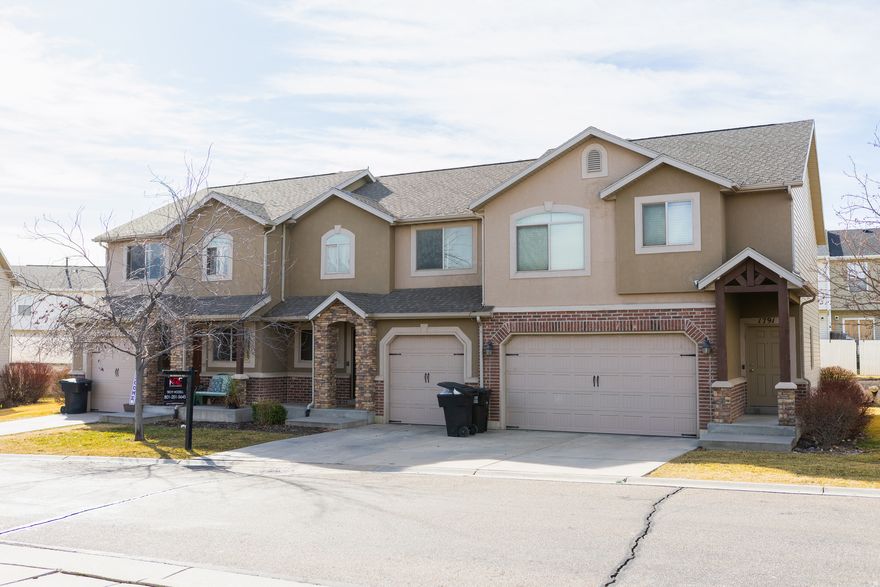 Ideally located just minutes from the freeway, this well-maintained 3-bedroom, 4-bath home offers quick access to Riverdale's shopping, dining, and essentials. EV charger in the garage. Set in a safe, welcoming neighborhood with a park directly across the street, it's perfect for morning walks, family time, or simply unwinding. Inside, enjoy nearly 2,000 square feet of functional space, including a fully finished basement with a custom entertainment center and kitchenette-ideal for movie nights, entertaining, or a separate living area. Don't miss your chance to own this versatile, conveniently located home-schedule your showing today!