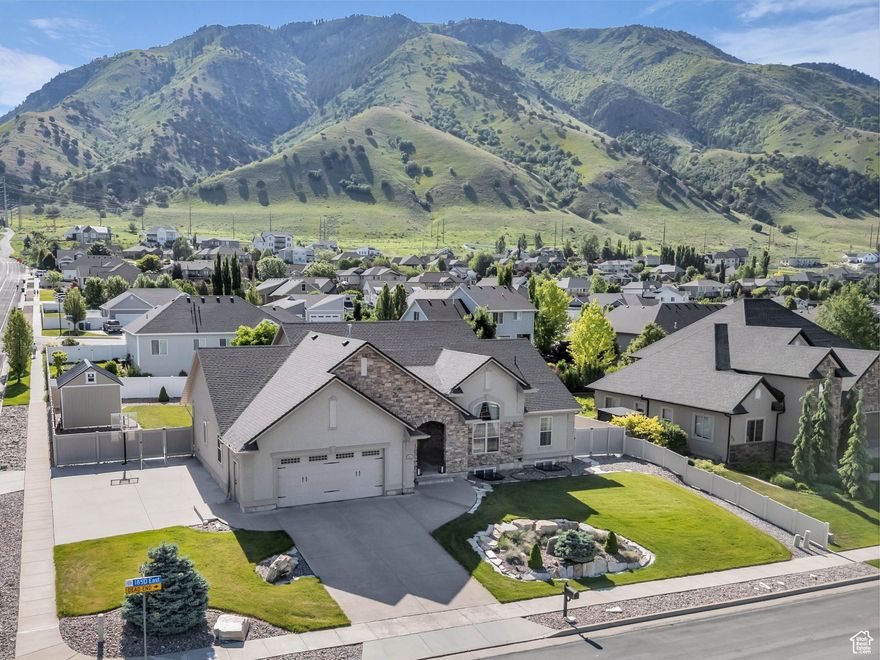 Beautiful home close to the foothills of Green Canyon. Over-sized garage with an extra parking area. Large covered front porch and extra large covered back patio. Large shed in the backyard. French doors to the back patio from the living area and from the primary bedroom. Primary bedroom has a dream en suite with separate bathtub and shower, large double vanity, and walk-in-closet. Vaulted ceilings throughout the main level. Butler's pantry and laundry area in addition to a walk in pantry. The basement is completely finished and has a large and very open great room. The front and backyards are both completely landscaped and easy to maintain.   Square footage figures are provided as a courtesy estimate only and were obtained from county records.  Buyer is advised to obtain an independent measurement. Agent related to seller. Solar install date is estimated.