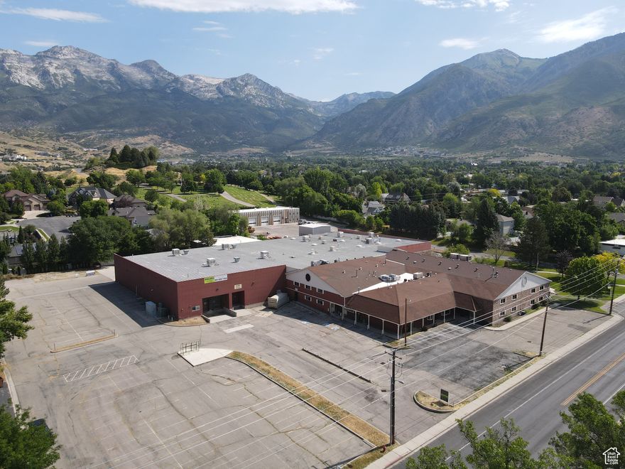 90,581 SF  Two (2) 9'x10' dock doors with seals and levelers  One (1) 5'x8' box height loading door  One (1) 14'x18' grade level door  Clear height: 20'  Over 17 different production rooms  Multiple break rooms and bullpens with ample bathrooms  Wet and dry suppression system  Ample heavy power  Exhaust vents  Floor drains  Power drops  Trash compactor  Water recyclers  Water cooling system  Multiple water lines running length of the warehouse  Gas forced heaters  Swamp coolers  Compressed airlines  Water hookups on both levels  Three compartment sink  Eye washing stations  Powder room  Skylights throughout  Masonry construction  Year built: 1990  Lot size: 4.12 acres  Ample parking  Zoning: Business Commercial  Location: convenient infill location in the heart of Alpine  Access: located off of Timpanogos Highway