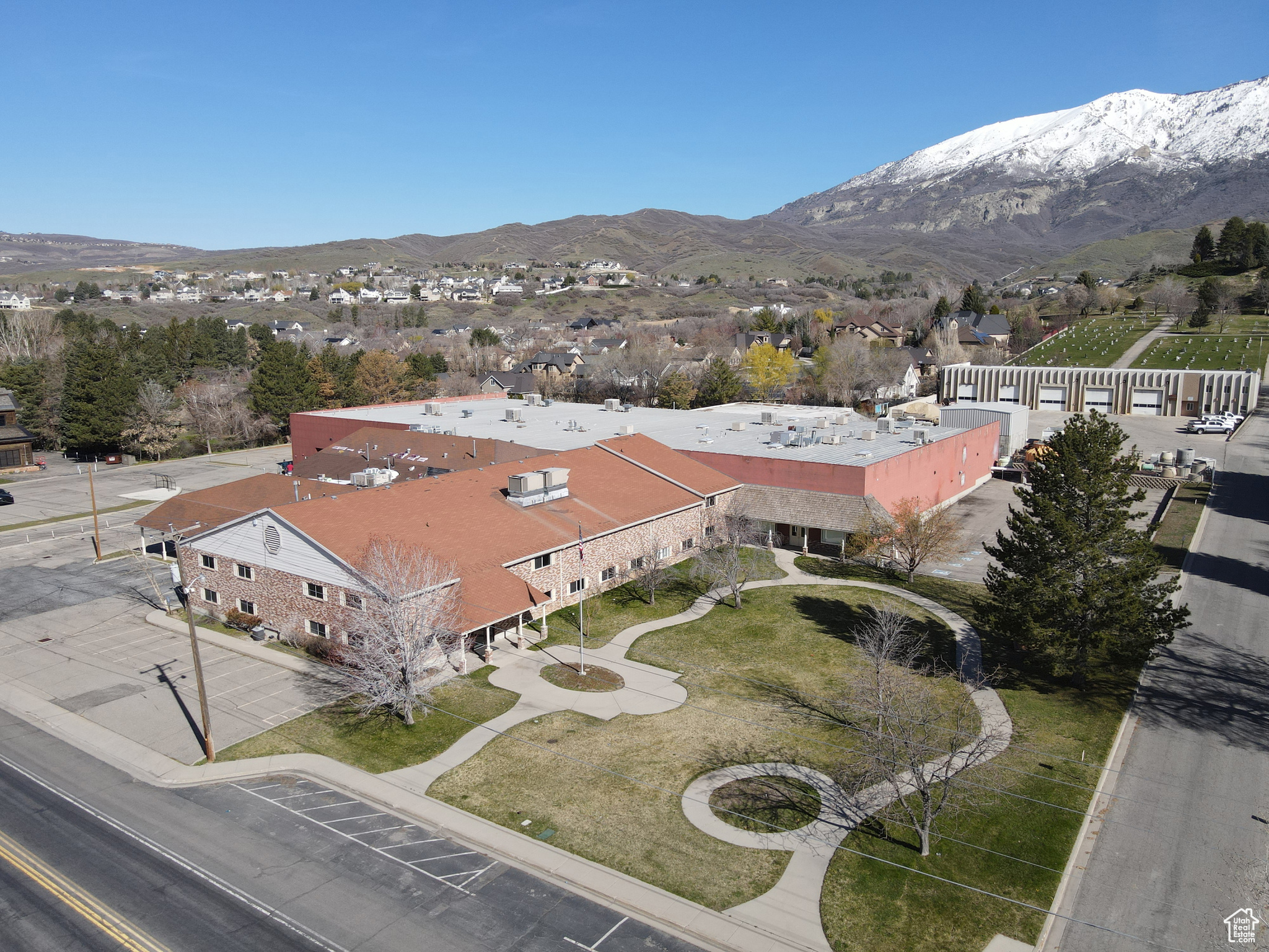 90,581 SF  Two (2) 9'x10' dock doors with seals and levelers  One (1) 5'x8' box height loading door  One (1) 14'x18' grade level door  Clear height: 20'  Over 17 different production rooms  Multiple break rooms and bullpens with ample bathrooms  Wet and dry suppression system  Ample heavy power  Exhaust vents  Floor drains  Power drops  Trash compactor  Water recyclers  Water cooling system  Multiple water lines running length of the warehouse  Gas forced heaters  Swamp coolers  Compressed airlines  Water hookups on both levels  Three compartment sink  Eye washing stations  Powder room  Skylights throughout  Masonry construction  Year built: 1990  Lot size: 4.12 acres  Ample parking  Zoning: Business Commercial  Location: convenient infill location in the heart of Alpine  Access: located off of Timpanogos Highway