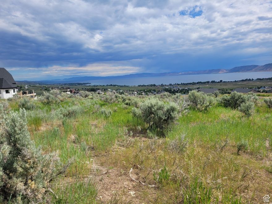 Amazing Property that Sits on the Hill Overlooking All of Bear Lake with Endless unobstructed views of beautiful Blue Lake. "SHORT-TERM RENTALS ALLOWED"!! on this, Larger .41 acre Gently sloped Lot which is perfect for a walkout basement and a large deck. Use our Builder who is familiar with building in this location, or bring your own which makes this an easy lot to build on with protected views of beautiful Bear Lake and the valley. Electrical, Sewer and Water are on easements surrounding the lot and are connected through the HOA. Bear Lake Golf Course 5 min; marina 10 min; Beaver Mtn Ski Resort about 20 minutes away. Can purchase an Ideal Beach Pass in this community to get access to swimming pool, hot tub, private beach, pickleball courts, basketball courts, parks and more for $1,950, Checkout the link @ https://bearlake.org/cat/entertainment Please allow 48 hours to respond to offers and all addenda. This lot is one of the highest lots that allow Short Term Rentals. All Measurements and Lot Information are a courtesy and should be verified by Buyer and Buyer Agent. Please call the Agent to verify your showing time.