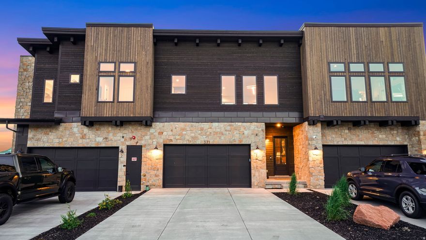 Welcome to effortless Wasatch Back living, where thoughtful design meets world-class amenities in one of Utah's most coveted private communities. Built in 2025 by Hillwood Homes, this 3-bed, 3-bath, 2,281 sq ft townhome at Red Ledges has been elevated well beyond its original finishes, with over $75K in owner upgrades that make it truly move-in ready. Step inside to soaring ceilings, abundant natural light, and a warm, designer aesthetic defined by bespoke details: custom noise-dampening wood panel walls, curated wallpaper accents, gallery lighting over artwork, and concealed wiring throughout. The kitchen features Thermador appliances and under-counter lighting, while the primary bath has been upgraded with heated elements for those cold mountain mornings. Every TV in a bedroom is a new Samsung Frame, with wires hidden naturally. The garage has been transformed into a true mountain basecamp: heated, finished with elevated design storage, a dedicated boot dryer, clothing rack, and its own TV, equal parts functional and fun. Fully furnished with designer pieces valued at $25K+, along with a premium Traeger grill and fire pit. Just unpack and enjoy. Red Ledges isn't just a place to live, it's a community built around how mountain people want to spend their time. Ski Deer Valley or Park City via the community's private shuttle, steps from your front door. Play golf on the Jack Nicklaus Signature 12-hole Golf Park, with the option to add a Golf Park membership granting access to the course and all the privileges that come with it. Rally at the brand new indoor tennis facility, complete with its own bar. Swim, train, and relax at the full fitness center, pools, kids' splash pad, and Village Center restaurant, all walkable from this unit. Furniture, all Samsung Frame TVs, Traeger, and fire pit included. Select personal art, sculptures, silverware, glassware, and the piano are excluded.
