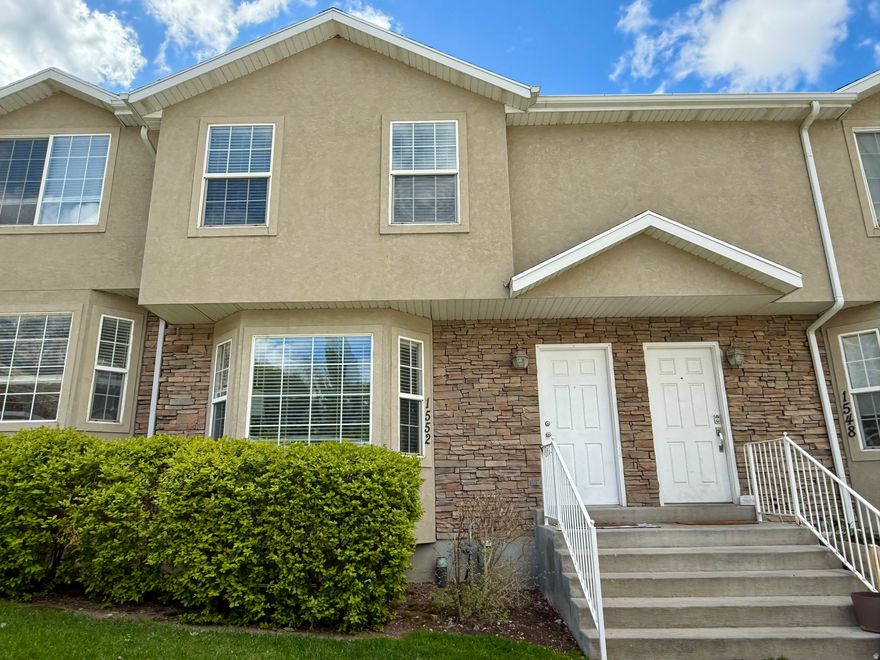 Enjoy stunning park views and a bright, open feel in this beautifully updated townhome backing directly onto Bicentennial Park. Situated in the Pioneer community, you'll love the easy access to BYU and I-15. Inside, recent upgrades include LVP and carpet flooring, recessed lighting, ceiling fans, and fresh two-tone paint. The modern kitchen features painted cabinetry, quartz countertops, tile backsplash, and stainless steel appliances. A walkout basement, relaxing garden tub, and 2-car carport add to the home's appeal.  Major systems-including the furnace and HVAC-have been updated within the last five years.  HOA includes water, garbage, snow removal, and lawn care for low-maintenance living. Square footage as per appraisal.