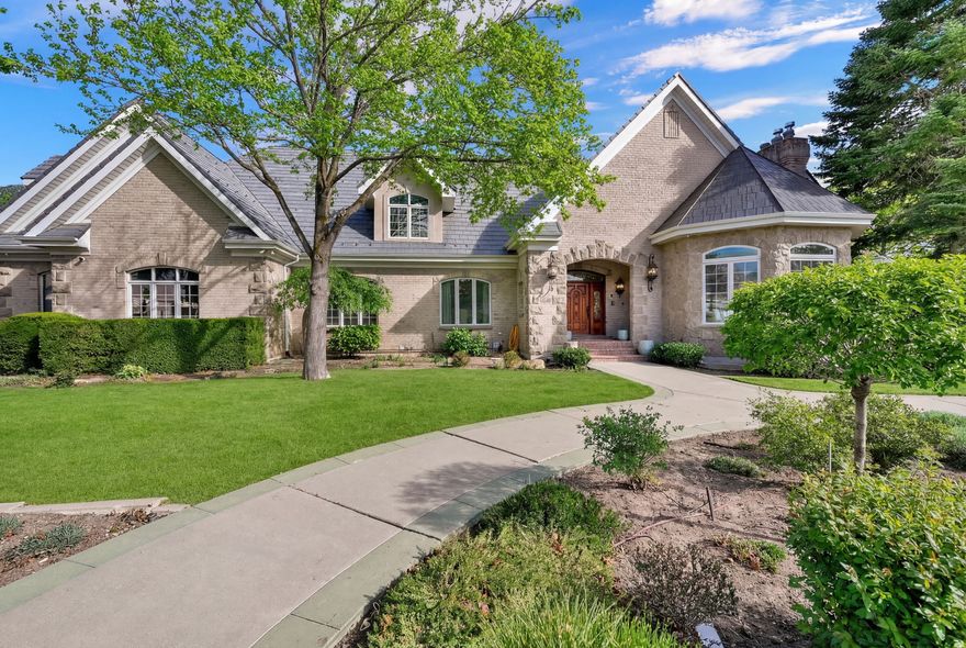 Tucked into the hillside of Bella Vista Heights, this remarkable Orem estate offers over10,000 square feet of thoughtfully designed living space on a private 0.64-acre lot with breathtaking mountain views and open space behind the home.  From the moment you enter, the home impresses with expansive living areas, soaring ceilings, and walls of windows that capture natural light and frame the surrounding scenery. The layout was designed with both entertaining and everyday living in mind, featuring multiple gathering spaces, four fireplaces, and a spacious kitchen with custom cabinetry and beautiful hickory flooring.  The walk-out lower level expands the living possibilities with a second full kitchen, large family room, guest suite, and game room area-perfect for hosting, extended family, or private retreat space.  The primary suite provides a luxurious escape with its own fireplace, spa-style bathroom, and private deck access overlooking the mountains.  Outside, the grounds offer mature landscaping, multiple patios and decks, RV parking with hookups, and a heated driveway and walkway for year-round ease.  Additional features include elevator access to all levels, new Lennox HVAC systems, tankless water heater, water softener, energy-efficient upgrades, and an oversized three-car garage with generous storage.  Located in a quiet cul-de-sac just minutes from shopping, dining, schools, and outdoor recreation, this home combines luxury, privacy, and convenience in one exceptional property. All details provided as a courtesy only, buyer encouraged to verify all information. Square feet obtained through a prior appraisal.