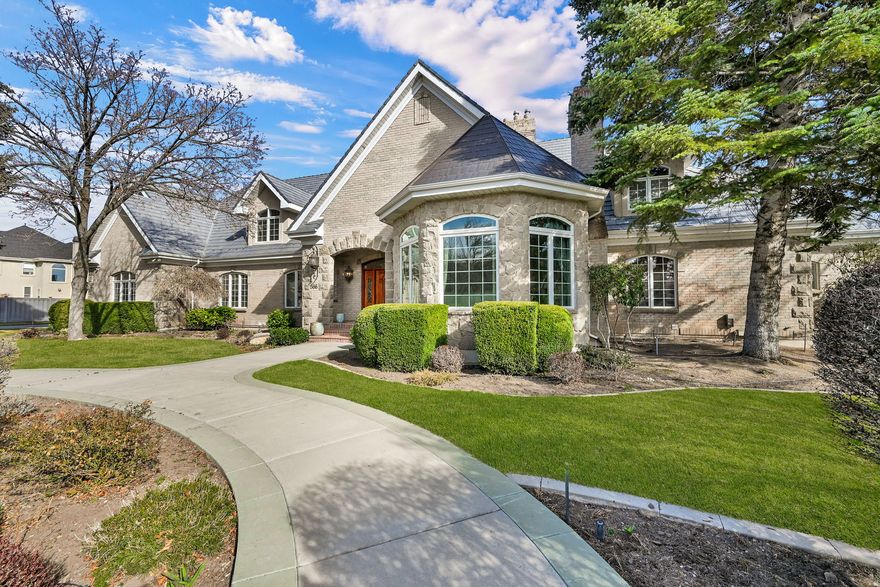 Tucked into the hillside of Bella Vista Heights, this remarkable Orem estate offers over10,000 square feet of thoughtfully designed living space on a private 0.64-acre lot with breathtaking mountain views and open space behind the home.  From the moment you enter, the home impresses with expansive living areas, soaring ceilings, and walls of windows that capture natural light and frame the surrounding scenery. The layout was designed with both entertaining and everyday living in mind, featuring multiple gathering spaces, four fireplaces, and a spacious kitchen with custom cabinetry and beautiful hickory flooring.  The walk-out lower level expands the living possibilities with a second full kitchen, large family room, guest suite, and game room area-perfect for hosting, extended family, or private retreat space.  The primary suite provides a luxurious escape with its own fireplace, spa-style bathroom, and private deck access overlooking the mountains.  Outside, the grounds offer mature landscaping, multiple patios and decks, RV parking with hookups, and a heated driveway and walkway for year-round ease.  Additional features include elevator access to all levels, new Lennox HVAC systems, tankless water heater, water softener, energy-efficient upgrades, and an oversized three-car garage with generous storage.  Located in a quiet cul-de-sac just minutes from shopping, dining, schools, and outdoor recreation, this home combines luxury, privacy, and convenience in one exceptional property. All details provided as a courtesy only, buyer encouraged to verify all information. Square feet obtained through a prior appraisal.