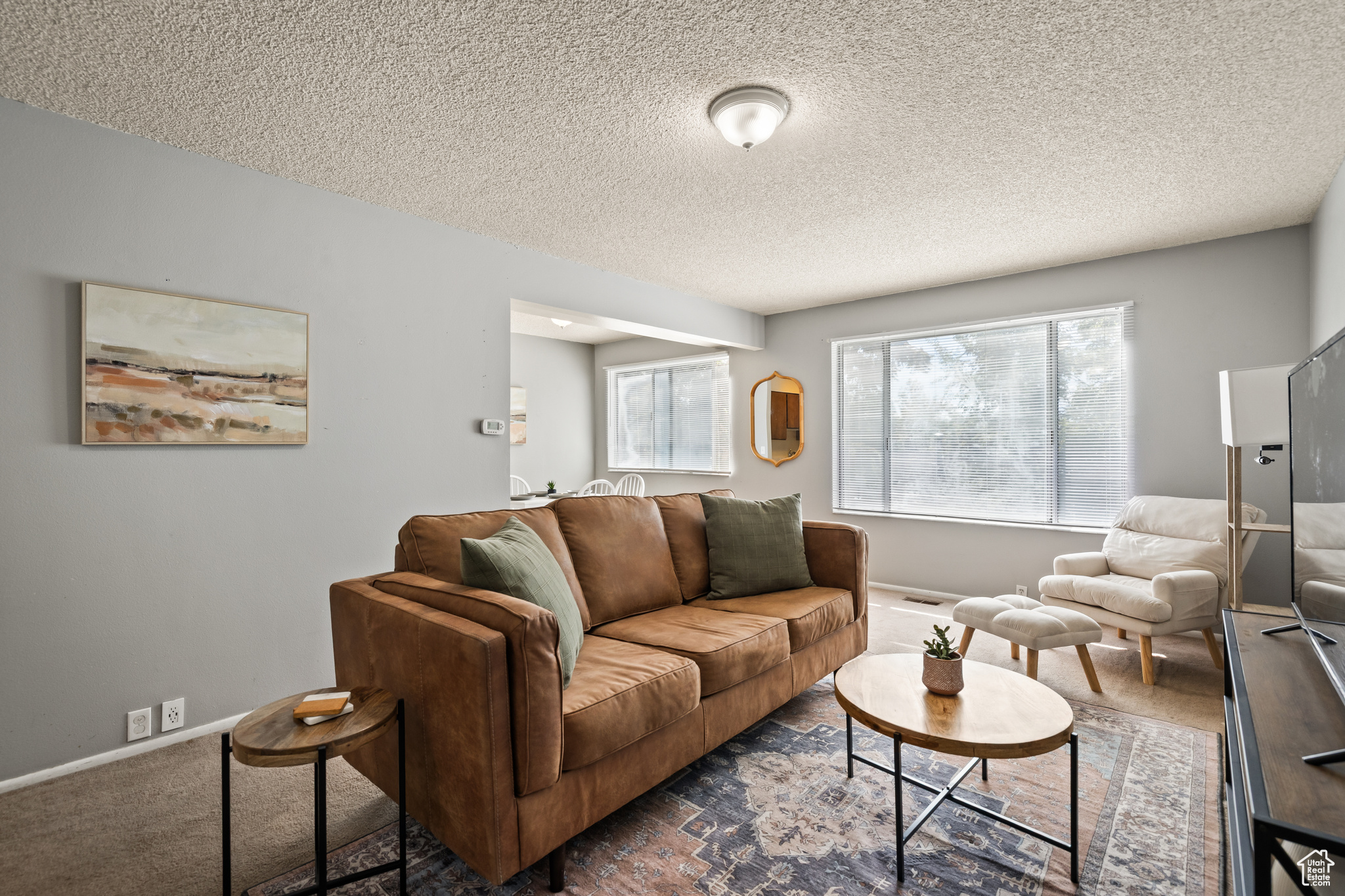 Rare 2-Bedroom Condo with ATTACHED GARAGE! Priced to sell! No more brushing off snow or walking in the cold-park in your garage and walk straight into your unit. This main-floor condo offers picturesque west-facing views with plenty of natural light. Prime location near the freeway, multiple colleges, shopping, and restaurants. Features include central air and heat, and Google Fiber. Perfect for a first-time buyer or investor, with a strong rental history. Units in this location, at this price, with garages, are hard to find! Vacant and easy to show. Buyer to verify square footage.