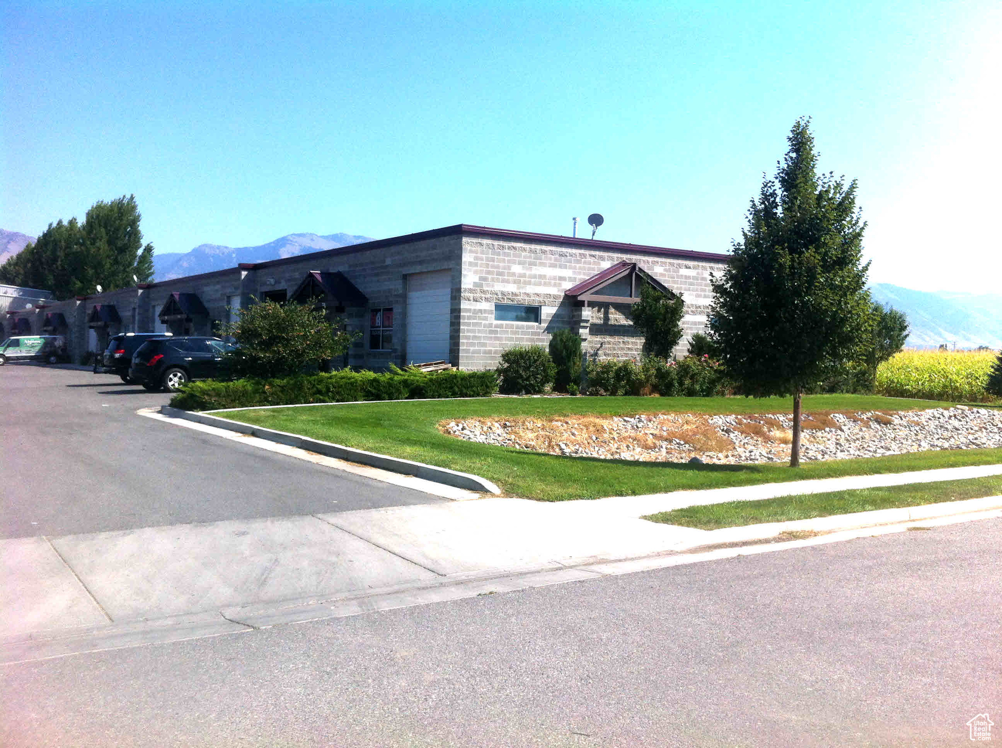 Logan UT Industrial Shop space with two 10'X12' overhead doors, 3 phase power and separate office area. End unit with 11 common area parking stalls. Designed for semi traffic and deliveries.
