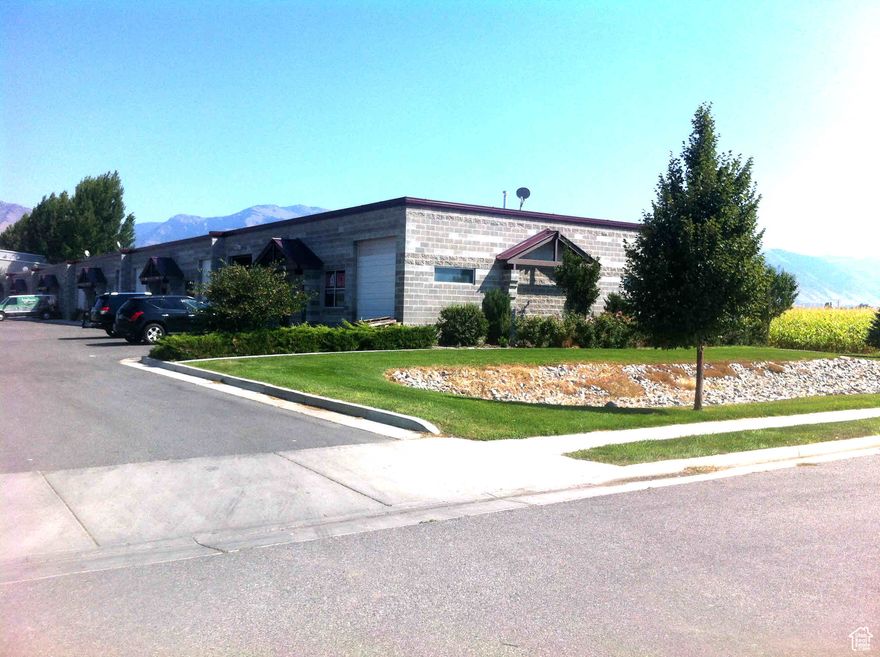 Logan UT Industrial Shop space with two 10'X12' overhead doors, 3 phase power and separate office area. End unit with 11 common area parking stalls. Designed for semi traffic and deliveries.