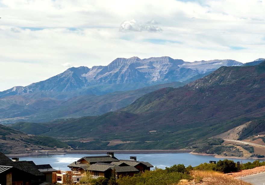 An exceptional opportunity to secure a premier homesite within Golden Eagle, offering sweeping 180-degree views across Kamas Valley, Mount Timpanogos, and Deer Valley East. Set on one of the community's larger parcels, this south-facing, downhill lot is thoughtfully positioned to capture abundant natural light while ensuring a remarkable sense of privacy, bordered by dedicated open space above, below, and along its eastern edge.  The setting is both tranquil and visually compelling, with a topography ideally suited for a sophisticated mountain residence designed to embrace expansive views and seamless indoor-outdoor living.  Located just 12 minutes from Deer Valley East, the property affords effortless access to world-class skiing, as well as hiking, biking, golf, fishing, and boating-offering a year-round lifestyle defined by outdoor recreation and natural beauty.  Approved building plans are available, presenting a rare opportunity to expedite the creation of a custom retreat in one of the area's most coveted settings.  A truly distinguished homesite-ready to bring a legacy mountain residence to life.