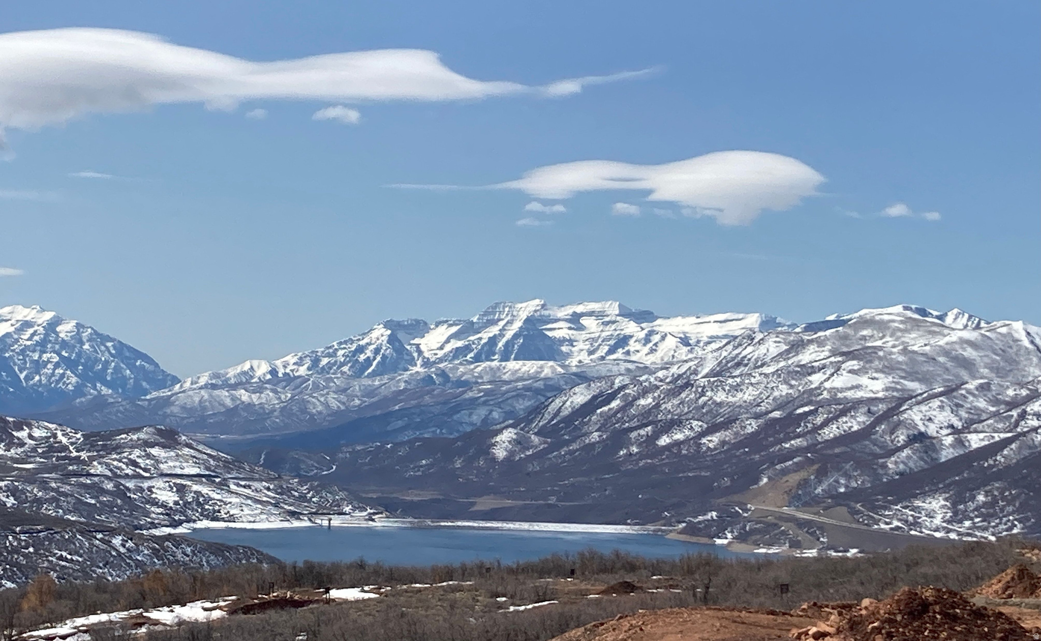 Expansive mountain scenery featuring snow-capped peaks overlooking Jordanelle Reservoir