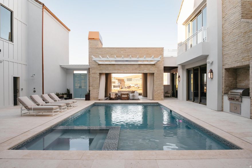 Welcome to your ultimate desert oasis! This luxury estate in Desert Color offers endless entertainment. Located near the 2.5 acre lagoon and adjacent to the new heated pool and pavilion, the home provides unparalleled amenities. Enjoy a private courtyard pool with a mesmerizing waterfall, a state-of-the-art golf simulator, and a custom theater room with plush seating. The expansive game room and sports bar are perfect for hosting memorable gatherings. Sleeping over 52 guests, it's ideal for large family reunions or retreats. High-end finishes throughout add sophistication to every corner. Conveniently access Desert Color's vibrant amenities, including lagoon activities, pickleball courts, and more. Build by Cedar Pointe Homes.