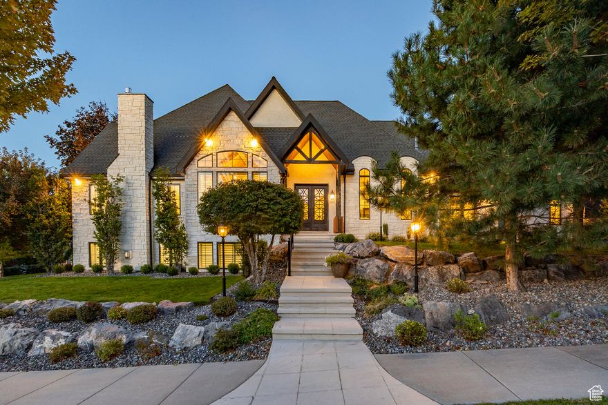 Discover this exquisitely remodeled custom home in the prestigious gated community of Draper Heights-perfectly positioned near scenic hiking and biking trails, with quick freeway access and convenient proximity to both Salt Lake City and Provo. Enjoy nearby grocery shopping, restaurants, and all the benefits of living in the heart of the Wasatch Front-with a front-row seat to Silicon Slopes. Inside, the home showcases a brand-new custom dream kitchen by Selah Cabinets, featuring high-end appliances, including a full-size SKS side-by-side refrigerator and freezer with a built-in water dispenser. The stunning Taj Mahal stone countertops and backsplash elevate the space, complemented by fully customized cabinetry designed for exceptional organization-with hidden trash bins, built-in spice racks, baking sheet dividers, and more. Additional highlights include a Ruvati workstation sink, double dishwashers, and a butler's pantry with appliance garages, an in-cabinet ice maker, and thoughtfully placed accent lighting and outlets throughout. Elegant imported Italian white oak flooring, exquisite millwork by Dream Woods (renowned for their craftsmanship in LDS temples), and a whole-home audio system add sophistication and comfort. The mudroom features deep, functional lockers with generous storage and hanging space for coats and gear. An incredible and spacious primary suite serves as a private retreat, complete with vaulted ceilings, a cozy fireplace, a massive walk-in closet, and a beautiful freestanding tub for ultimate relaxation. The home office, also with its own fireplace and vaulted ceilings, provides an elegant and inspiring workspace. A dedicated home gym and fully equipped home theater make it easy to stay active and entertained without ever leaving home. Recent upgrades extend to the exterior and mechanical systems, including a new stone faade, Pella windows and sliding doors, a new roof (2019), and top-tier Lennox modulating furnaces with high-SEER A/C compressors-plus a whole-home humidifier for year-round comfort. Select furnishings, including a custom dining set and nearly new Restoration Hardware pieces, are negotiable-offering a turn-key luxury living opportunity in one of Draper's most desirable neighborhoods.