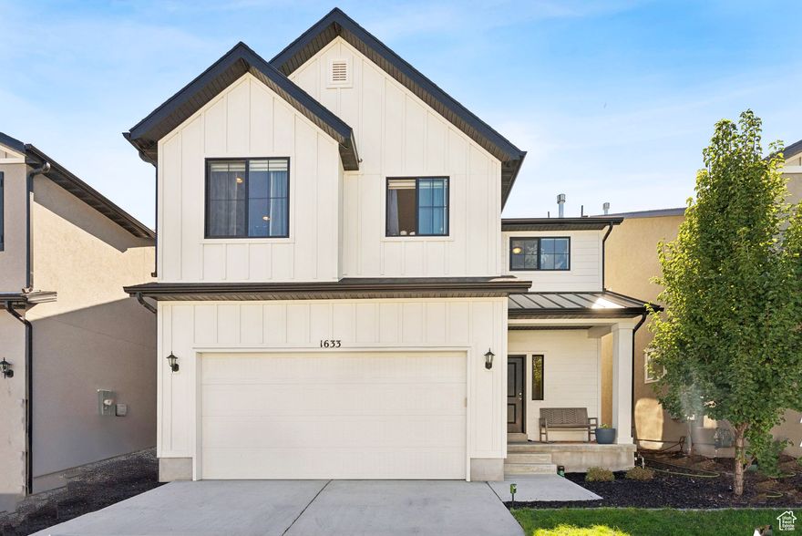 Welcome to this stunning West Jordan residence, perfectly situated in a desirable central location. Built just 5 years ago, this home has been meticulously maintained and offers numerous upgrades throughout. Upstairs, you'll find four spacious bedrooms, a versatile loft, and a large laundry room for added convenience. The main level features an oversized office-ideal for working from home-alongside an open-concept living area that's filled with natural light from the many windows. Enjoy evenings in your charming backyard with mountain views, perfect for relaxing or entertaining. With generously sized bedrooms, modern finishes, and a welcoming neighborhood, this home blends comfort, function, and style in one incredible package.
