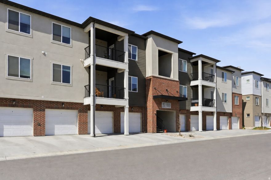 Welcome home, where modern design meets unbeatable convenience in the heart of Lehi's thriving Exchange at Gardner Point community. This beautifully updated 3-bedroom, 2-bath condo features newer carpet, 9-foot ceilings, an open kitchen, and beautiful finishes that make everyday living feel elevated. Offering 1,233 sq ft of thoughtfully designed, open concept living, the home blends comfort and functionality with ease. The stylish kitchen shines with quartz countertops, ample cabinetry, and generous storage, while a tankless water heater adds efficiency and peace of mind. Enjoy the convenience of a private 1-car garage and the rare benefit of a ground-level front door, making access effortless. Step outside and take advantage of resort-style community amenities, including a clubhouse with a full gym, pool, pickleball courts, playgrounds, and scenic walking paths. Located in one of Lehi's most connected areas, you're just minutes from Silicon Slopes, I-15, Frontrunner, shopping, and dining.  Whether you're a first-time buyer or downsizing, this home offers low-maintenance living in a fast-growing, high-demand neighborhood.