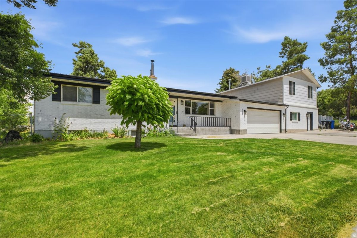 Single-family residence featuring a split-level design and a two-car garage