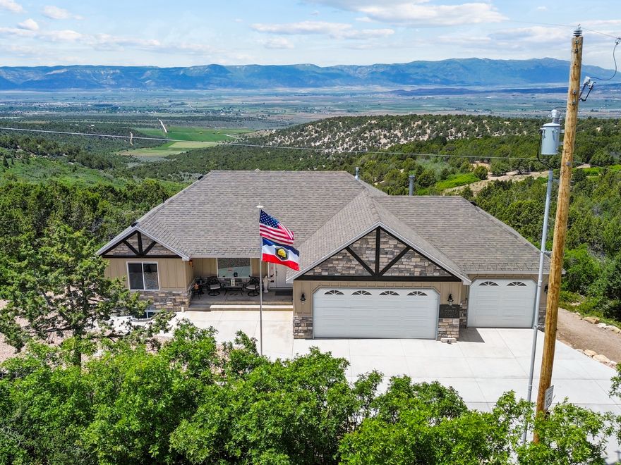 Experience breathtaking panoramic views from this beautifully maintained Sanpete County retreat with year-round access. Ideal as a full-time residence or weekend getaway, this home offers peace and privacy, with quality craftsmanship throughout, including high-end cabinetry, beautiful countertops, and durable LVP flooring. The fully finished walk-out basement features a second kitchen and private entrance, perfect for guests or multi-generational living. The oversized 4-car garage is exceptionally large at 974 sq. ft., providing ample space for vehicles, storage, or a dedicated workshop, bringing the total finished square footage to 3,684 sq. ft. The property also includes an owned 1,000-gallon propane tank. Square footage figures are provided as a courtesy estimate only and were obtained from County Tax Records. Buyer is advised to obtain an independent measurement.